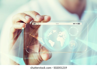 business, technology, science and people concept - close up of male hand holding and showing transparent smartphone earth globe projection - Powered by Shutterstock - Get 15% off with code: PIKWIZARD15