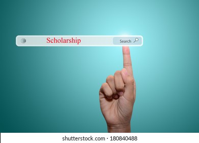 Business And Technology, Searching System And Internet Concept - Male Hand Pressing Search Scholarship Button. 