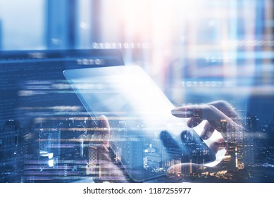 Business and technology, software development, IoT concept. Double exposure, man programmer, software developer working on digital tablet and smart city with binary, html computer code on screen
