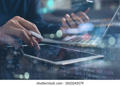 Business and technology, software development, IoT concept. Double exposure, man programmer, software developer working on digital tablet and smart city with binary, html computer code on screen - Shutterstock ID 1810243579
