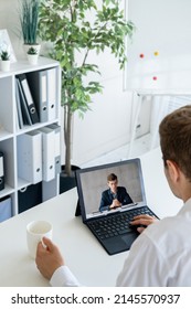 Business Teleconference. Video Chat. Professional Webcast. Male Partners Discussing Project Working Online Using Laptop Screen In Virtual Office.