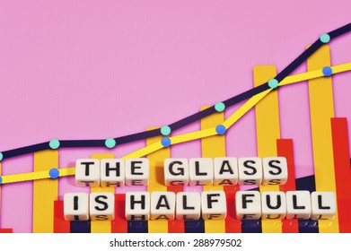 Business Term With Climbing Chart / Graph - The Glass Is Half Full