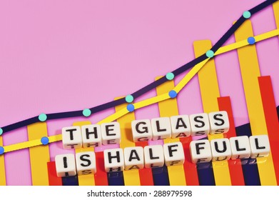 Business Term With Climbing Chart / Graph - The Glass Is Half Full