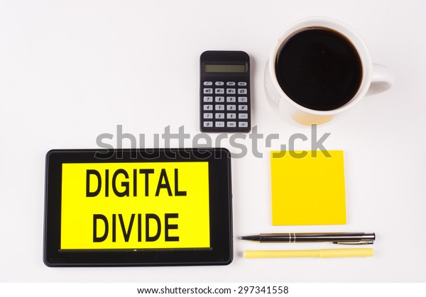 Business\
Term / Business Phrase on Tablet PC with a cup of coffee, Pens,\
Calculator, and yellow note pad on a White Background - Black\
Word(s) on a yellow background - Digital\
Divide