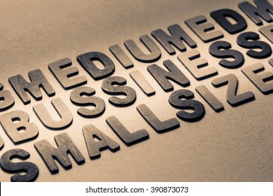 Business Topic In The Row Of Wood Letters With Part Of Medium And Small Size Word (SMB)