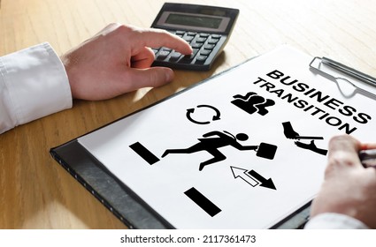 Business Transition Concept With Hand Using A Calculator