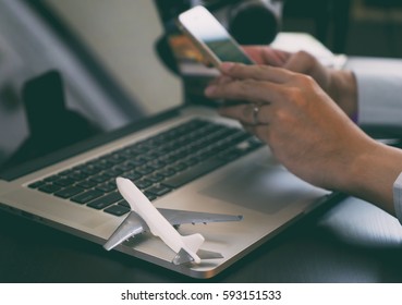 Business Traveler Using His Phone To Book His Business Trip Online. Man Reserving His Vacation Trip On Online Travel Agency Application.