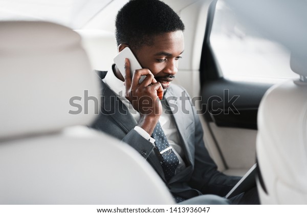 Business Trip. Man Talking On Phone And Discussing\
Work, Sitting In Car