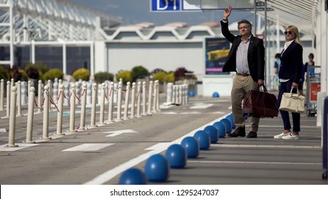 Business Trip, Man And Woman Hailing Taxi Near Airport, Transportation Services