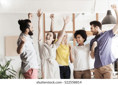 Business, Triumph, Gesture, People And Teamwork Concept - Happy International Creative Team Raising Hands Up And Celebrating Victory In Office