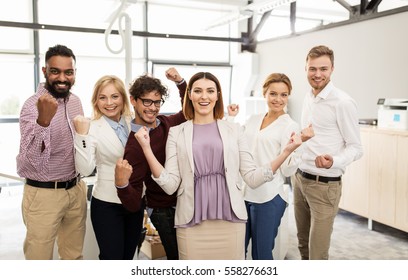 Business, Triumph, Gesture, People And Teamwork Concept - Happy Creative Team Showing Fists And Celebrating Victory At Office