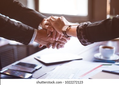  Business trust commitment which Business Partners holding hands with Help, trust ,support ,empathy and factors relationship marketing for reach successful achievement and meeting commit concept.
