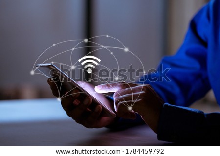 Business using smartphone,with wifi icon,business communication social network concept.