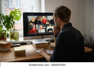 Business Video Conferencing. Young Man Having Video Call Via Computer In The Home Office. Multiethnic Business Team. Virtual House Party. Online Team Meeting Video Conference Calling From Home