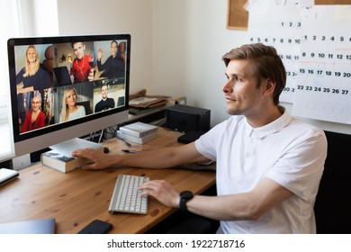 Business Video Conferencing. Young Man Having Video Call Via Computer In The Home Office. Multiethnic Business Team. Virtual House Party. Online Team Meeting Video Conference Calling From Home