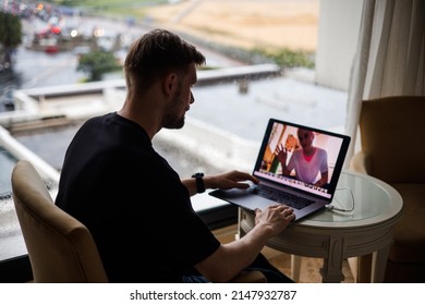 Business Video Conferencing. Young Man Having Video Call Via Computer In The Home Office. Multiethnic Business Team. Virtual House Party. Online Team Meeting Video Conference Calling From Home