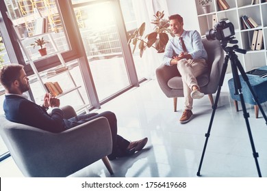 Business Vlog. Two Young Men In Smart Casual Wear Talking While Making New Video Indoors