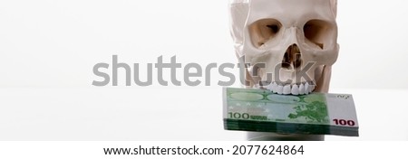 Business, wealth and greed concept. Human skull with money. Copy space. Foto stock © 