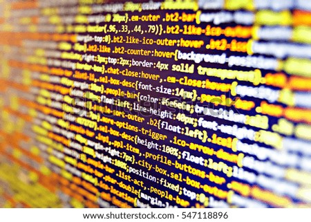 IT business.  Webdesigner Workstation. Displaying program code on computer. Website codes on computer monitor. SEO concepts for better SERP. Database bits access stream visualisation. 
