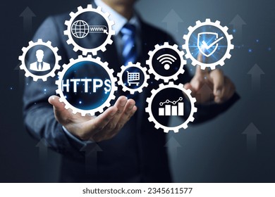 Business website domain url https more secure than http. Businessman pointing shield and ticking check mark continuity in online system Online sales, banking confidential information, personal data.