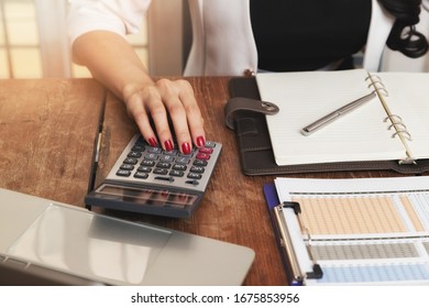 Business Woman Accountant Or Banker Using Calculator In Retro Office. Savings, Finances And Economy Concept.