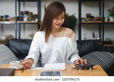 Business Woman Accountant Or Banker Using Calculator In Office. Savings, Finances And Economy Concept.