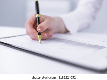 business woman analyzing the financial schedule. photo with copy space