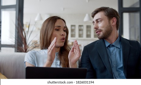 Business Woman Arguing With Man At Home Office In Slow Motion. Portrait Of Upset Wife Speaking With Husband On Sofa Emotionally. Family Couple Discussing House Work In Modern Apartment.