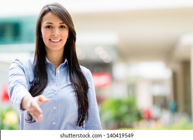 Business Woman With Arm Extended For A Handshake