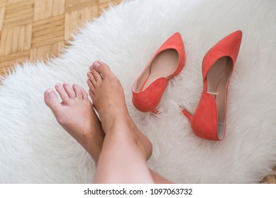 Business Woman Back To Home Take Off High Heel Shoes. Young Business Woman Took Her High Heels Off To Rest The Feet. Woman's Relaxing At Home. Smooth Female Legs. Pain In Legs