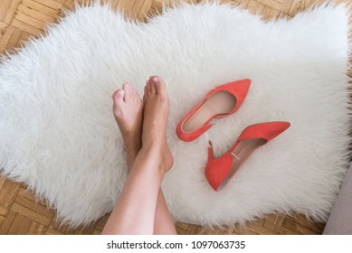 Business Woman Back To Home Take Off High Heel Shoes. Young Business Woman Took Her High Heels Off To Rest The Feet. Woman's Relaxing At Home. Smooth Female Legs. Pain In Legs