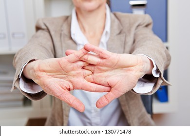 Business Woman With Back Pain Streching In Her Office