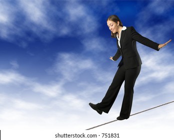 Business Woman Balancing On Rope