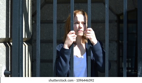 Business Woman Behind Bars