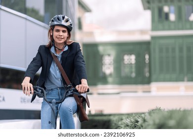 Business woman with bicycle to work on urban street in city. Transport and healthy lifestyle concept. american woman riding a bicycle on a road in a city street. woman with bicycle in modern city.	 - Powered by Shutterstock