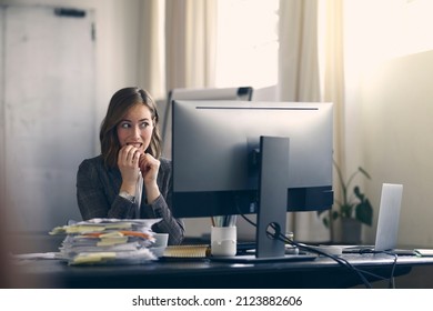 Business Woman Biting Nails In Suspense Being A Little Afraid While Looking At Her Computer. Modern Office Space.	