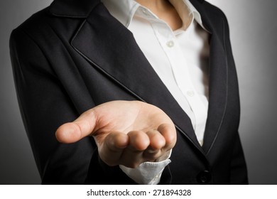 Business Woman In Black Suit Open Palm Hand For Show Something.