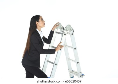 Business woman in black suit and trouser long hair, concept climbing ladder stair breakthrough goal, studio lighting white background isolated