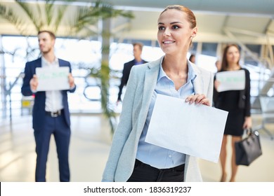 Business Woman With Blank Welcome Sign As A Service To The Guest At The Airport