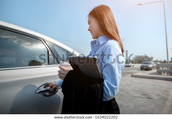 Business woman with car and\
coffee