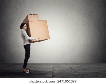 Business woman carrying large boxes - Powered by Shutterstock