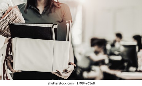 Business Woman Carrying Packing Up All His Personal Belongings And Files Into A White Cardboard Box To Resignation In Modern Office, Resign Concept