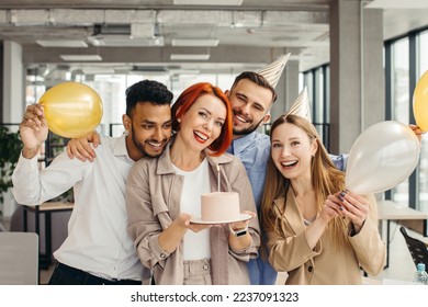 Business woman celebrating birthday and doing a party with colleagues in her office. - Powered by Shutterstock