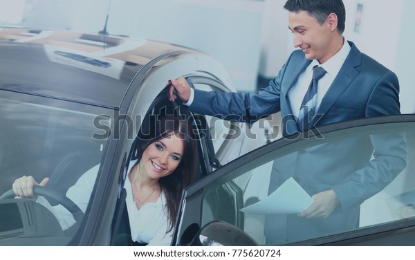 business woman chooses\
a car in the office