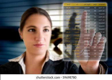 Business Woman Choosing Her Flight At The Airport On A Digital Futuristic Display