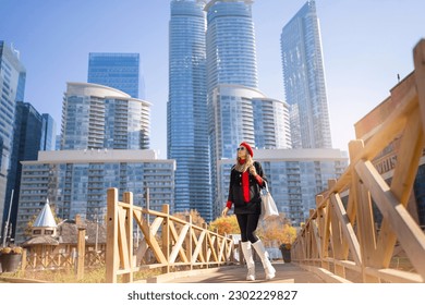 Business woman in city center looking at view of skyline skyscrapers in Toronto downtown , Canada. High quality photo - Powered by Shutterstock