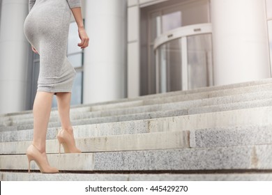 Business woman climbing stairs. Close up. Business concept.