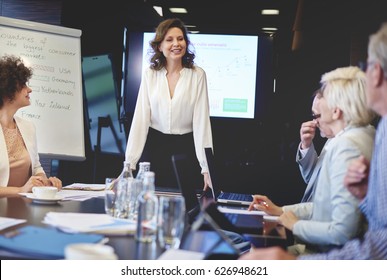 Business Woman In Conference Room Giving Speech
