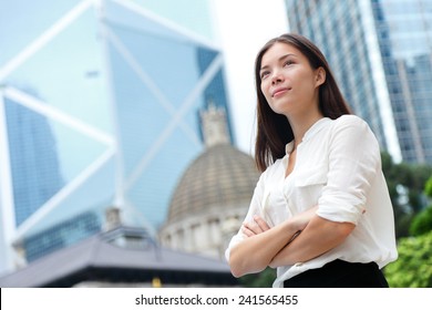 Business Woman Confident Portrait In Hong Kong. Businesswoman Standing Proud And Successful In Suit Cross-armed. Young Multiracial Chinese Asian / Caucasian Female Professional In Central Hong Kong.