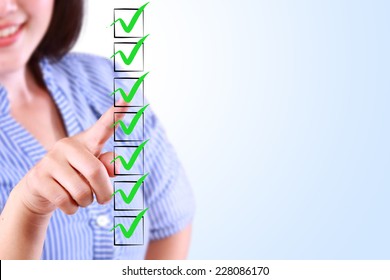 business woman designed on a checklist box - Shutterstock ID 228086170